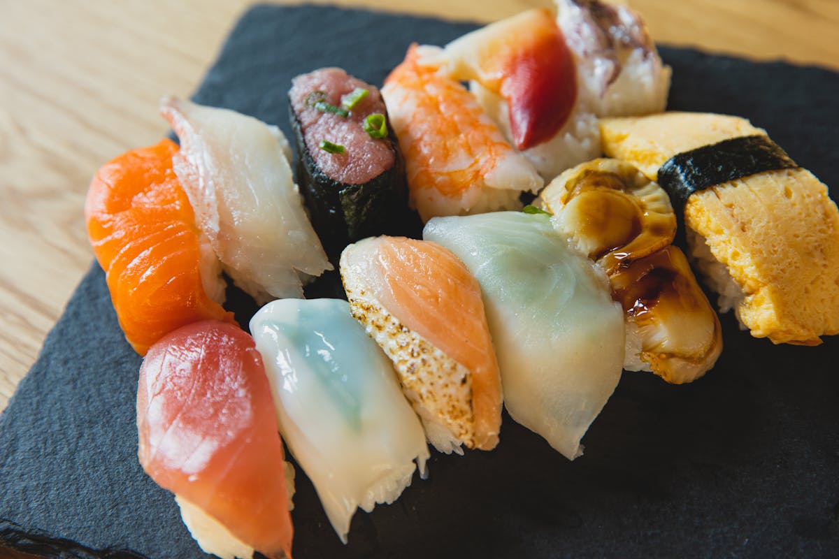 Assorted nigiri on slate board